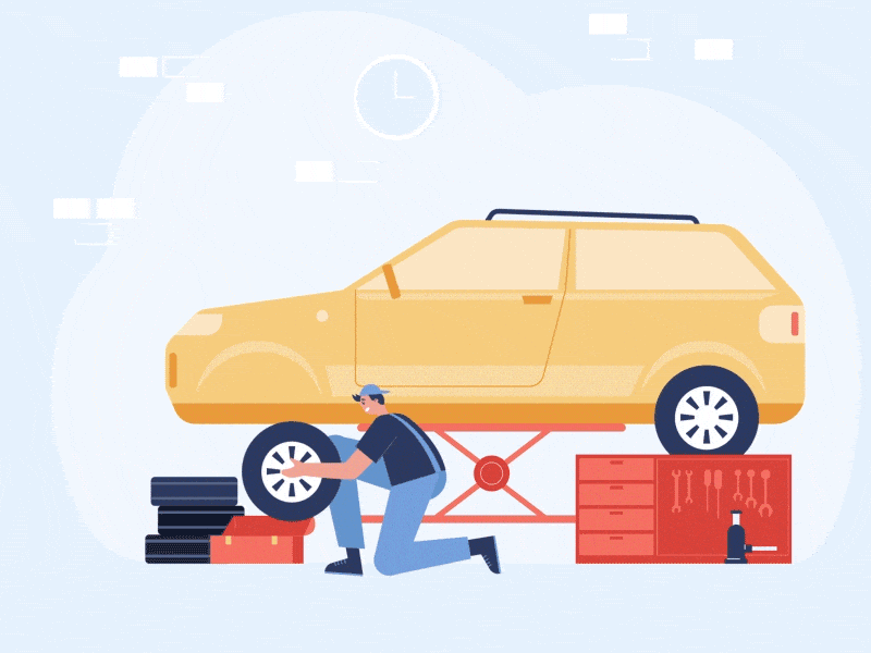 A Nine Tyres technician fitting a wheel to a car raised on a workshop jack, with tyres and a tool chest beside him